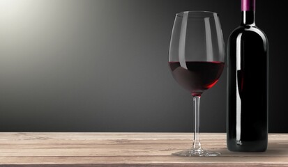 Bottle and glass of sweet alcohol red wine
