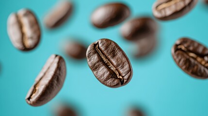 Floating coffee beans against blue