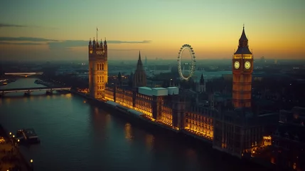 Fotobehang London London eye and big ben lighting up at twilight above river thames  © Andres Mejia