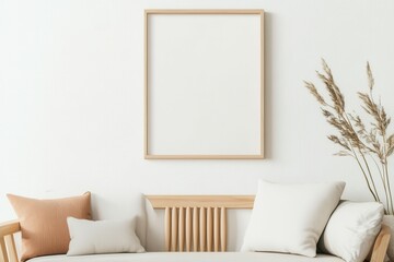 Modern room featuring a framed portrait on a wall with a warm ambiance, vibrant orange cushions on a chair, and a small tropical plant adding freshness.