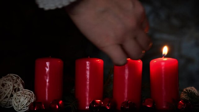 Traditional four advent weeks before Christmas holidays. Red candles burning and plastic free decoration. Winter cozy home time atmosphere 