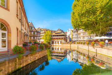 Picturesque half timbered buildings and the Maison des Tanneurs (tanners house) in the Petite France canal zone along the Ill river in the historic city of Strasbourg, in the Alsace region of France.	