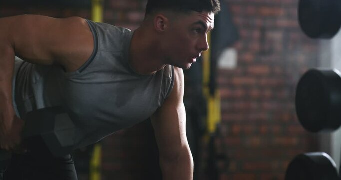 Dumbbell, training and man tired after arm exercise, muscle growth workout or fitness club challenge. Burnout, gym fatigue and sport person, athlete or bodybuilder exhausted after bicep weightlifting