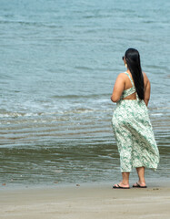 A woman looking at the horizon in the sea