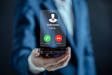 Businesswomen use s smartphone with incoming call from unknown number, spam, prank caller, hoax person, fake identity, scammer, scam with mobile phone, hacker, Call center gang, crime, phishing.