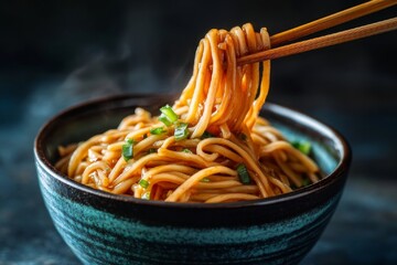 Closeup of Steaming Noodles in a Bowl with Chopsticks