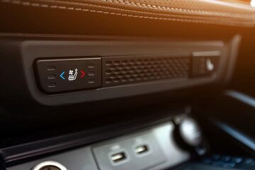 Close-up of   of seat  heating  buttons on car panel, no trade marks