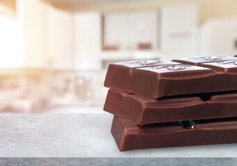 Milk chocolate sweet bars on the desk