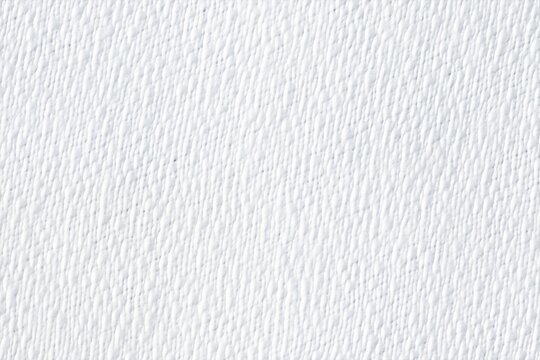Texture of white batiste cotton fabric with a subtle, textured surface. The image showcases the fine details and patterns of the paper, ideal for backgrounds or design elements.