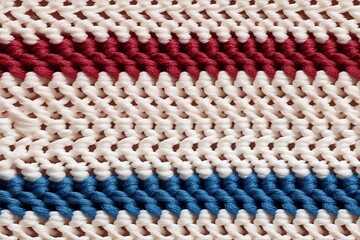 Knitted batiste cotton fabric featuring alternating stripes of red, white, and blue. The texture is soft and intricate, showcasing the craftsmanship of the knitting technique.