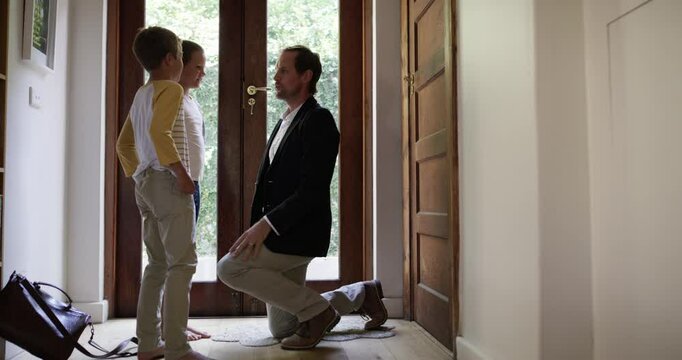 Welcome, front door and hug with happy and family for greeting, excited and relax. Love, business man and reunion with children and parents in hallway of home for break, hello and smile together