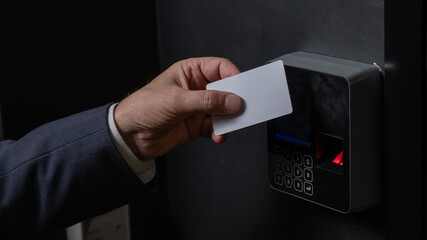 A man opens the door with a card. Modern electronic lock. Keyless Entry