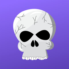 A skull with a black face and white teeth