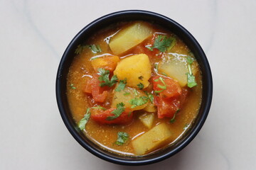 Tomato Batata Rassa Bhaji, tangy curry made with tomato, potato, cononut and spices, dish from...