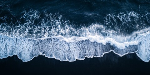 Fototapeta premium Aerial View of Pristine White Waves Crashing on Deep Navy Blue Beach: Minimalist Ocean Landscape for Elegant Graphic Design. Tranquil Seascape with Foamy Surf Texture, Perfect for Marketing Background