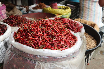 Red dried chili peppers as background, indian red hot hot chili pepper in a bag at the street spice market