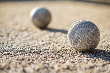 Petanque balls on a sand gravel court, close-up