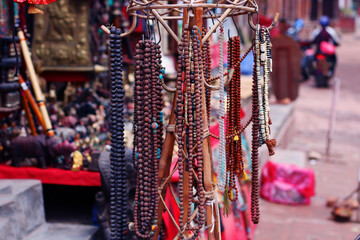 Religious Beads for Sale at a Curio Shop in Nepal. These traditional beads, often used for prayer and meditation, are a reflection of Nepal's rich spiritual and cultural heritage.