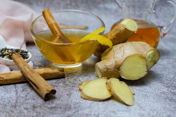 jar of fresh ginger tea with lemon and cinnamon