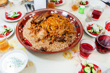 Real pilaf, main course of Uzbek cuisine cooked with rice, pieces of meat, grated carrots and onion