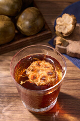 A cup of brewed monk fruit drink, a traditional Chinese medicine