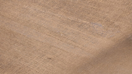 Close-up shot to reveal texture of sack.  Simple background or texture. Sackcloth or burlap texture. Closeup of natural sackcloth, canvas, fabric, jute, pattern for background