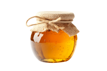 Natural honey in a jar that highlights honeycomb isolated on white transparent background