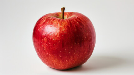 A whole red apple isolated on a white background