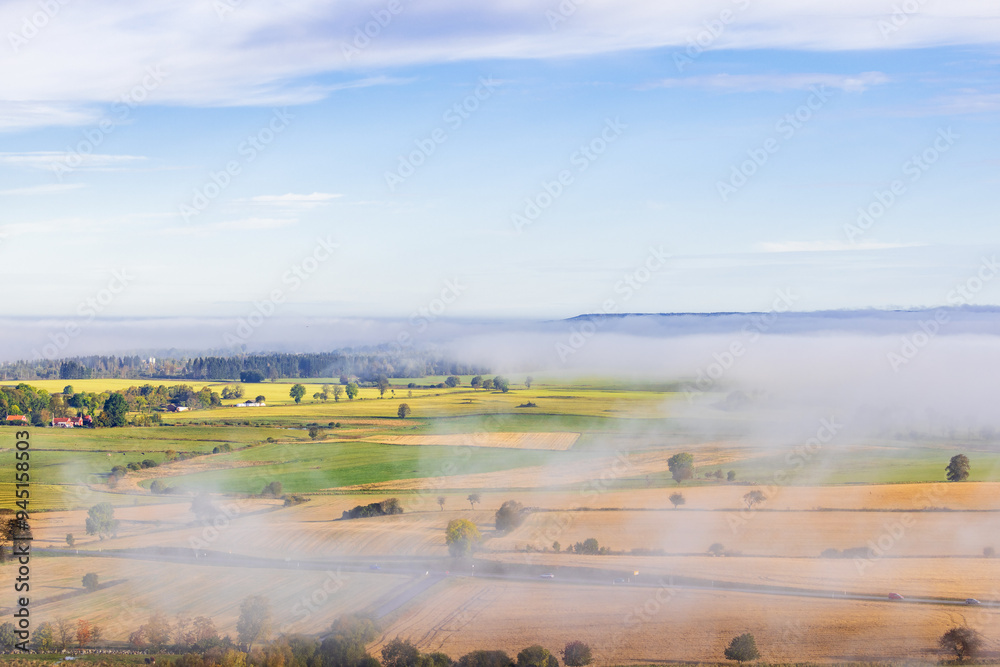 Wall mural High angle view at the countryside with fog