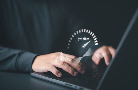 Speed test for internet network connection. Man using a laptop computer to benchmark check wireless networking or 5G cellular Mbps or Gbps speed quality. WiFi 7 download or upload transfer rate.