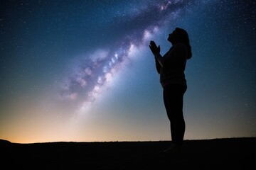 Fototapeta premium Grateful Soul Offering Prayers Under a Starry Sky with Ground Shadow