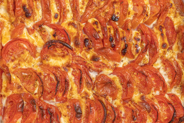Baked tomatoes with mozzarella cheese.