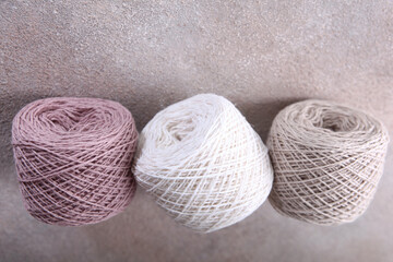 A set of colored cotton yarn for hand knitting. Multicolored balls of yarn for knitting. Handmade work. The concept of a hobby. Skeins of yarn for knitting as a background. Copy space.