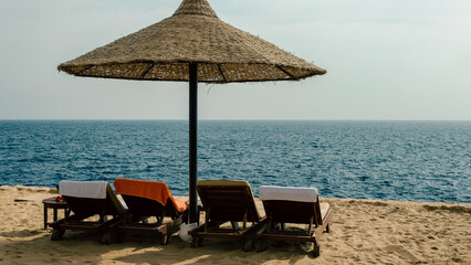reed beach umbrella on the background of the sea in Egypt