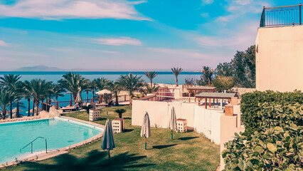 empty lawn with folded umbrellas on the coast of southern Sinai Egypt Sharm El Sheikh