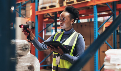 Black woman, scanner and tablet with inventory in logistics for pricing, counting stock or distribution at warehouse. Young African, female person or employee checking product code for supply chain