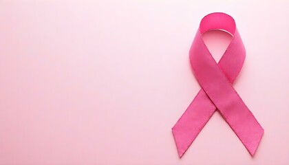 Pink ribbon, the international symbol for breast cancer awareness, elegantly placed on a light, minimalist background. Represents hope and support for those affected by the disease