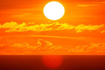 Amazing sun Beautiful light sunset or sunrise nature in golden sky over sea,Beautiful nature landscape background