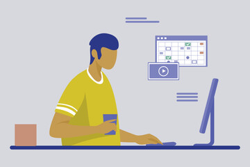 The boy is working on the monitor.