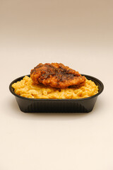 Mac and cheese tasty Italian pasta with Cheddar cheese on plain background