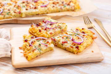 Homemade potato tarte flambee, savory flam cake with onion, bacon, cheese and potatoes