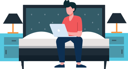 Boy sitting on bed working on laptop.