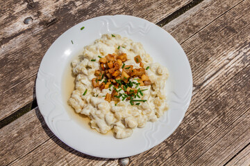 National dish of Slovakia - Bryndzove halusky (potato dough lumps with a sheep cheese and bacon)