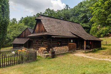 Obraz premium Old houses in the open air museum (Valasske muzeum v prirode) in Roznov pod Radhostem, Czechia
