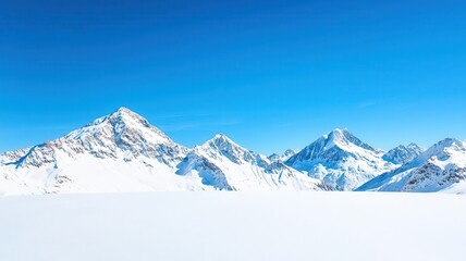 Fototapeta premium Snowcapped mountains under a clear blue sky, winter weather, cold and majestic