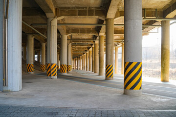 The scene of the underside of a massive railway station bridge.