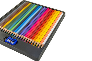 Wooden colored pencil crayons preparing the student for the start of the school year on the desk on a white background