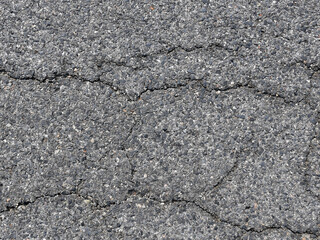 tarmac driveway texture with crack, top view of damage asphalt road surface