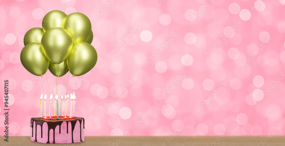 Poster birthday cake with bunch of golden or yellow balloons on blurred pink background. empty space for te