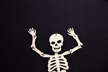 White halloween skeleton on black background